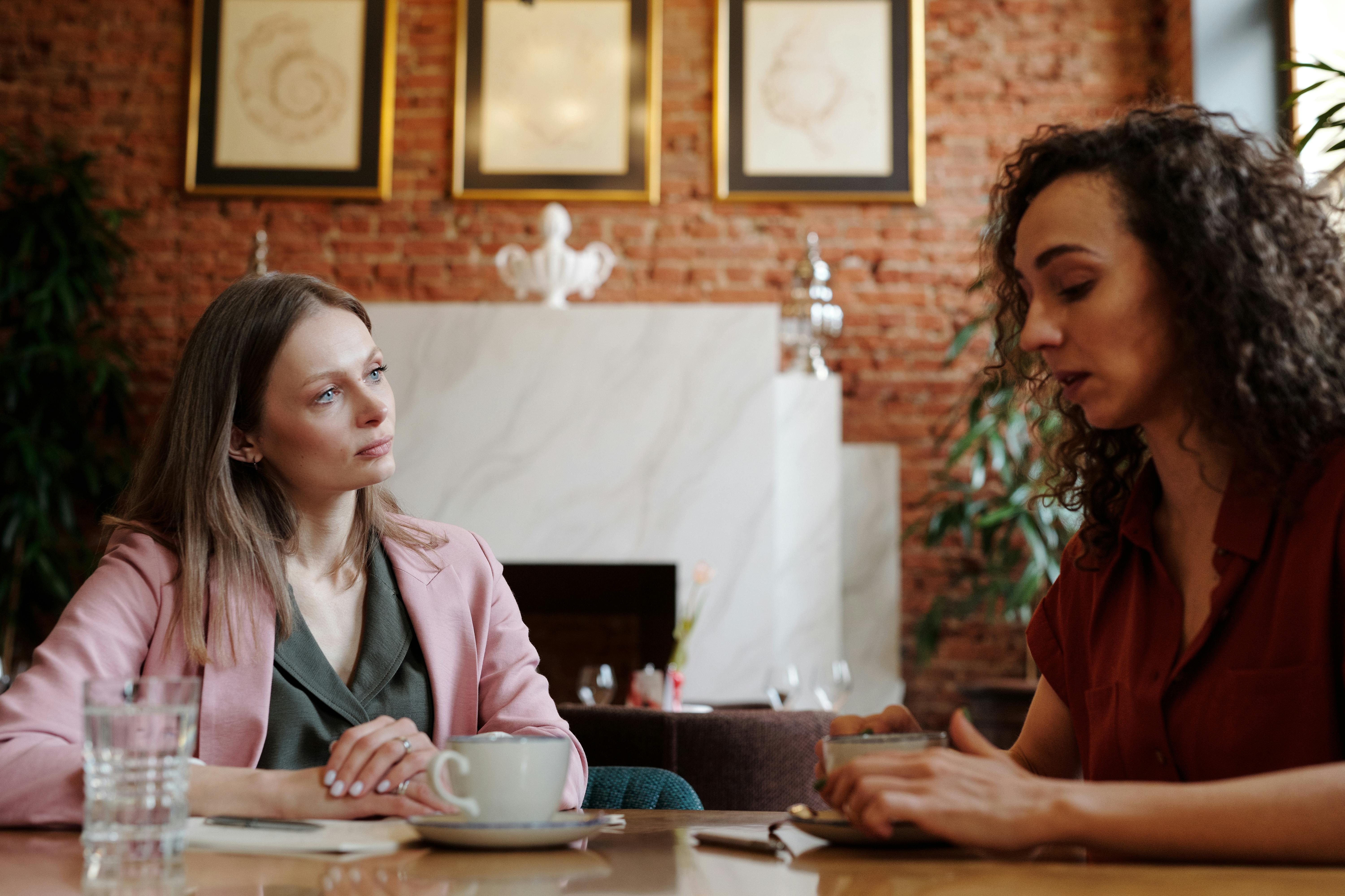 https://www.pexels.com/photo/people-talking-while-drinking-coffee-at-the-restaurant-4340080/