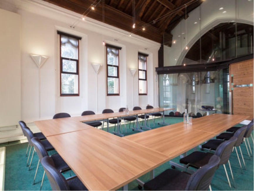 Annex with arched windows and office seating