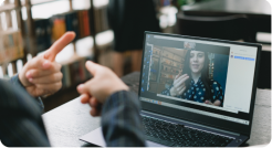 two individuals on a video call speaking in sign language