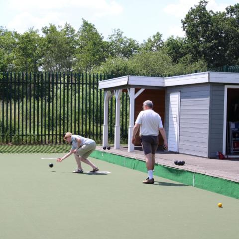 Two men enjoying playing bowls at Aberford Bowls Community Centre