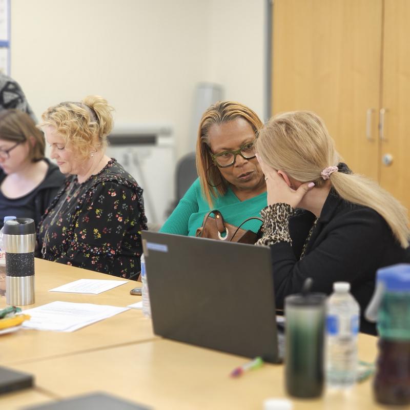 Attendees discussing course content.