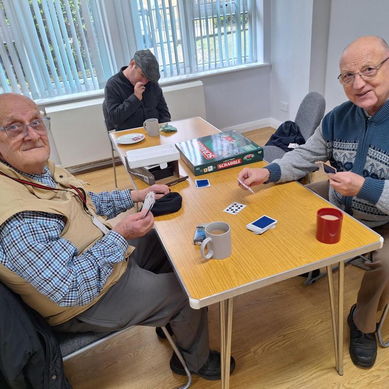 A group of three people at the Men That Meet event.