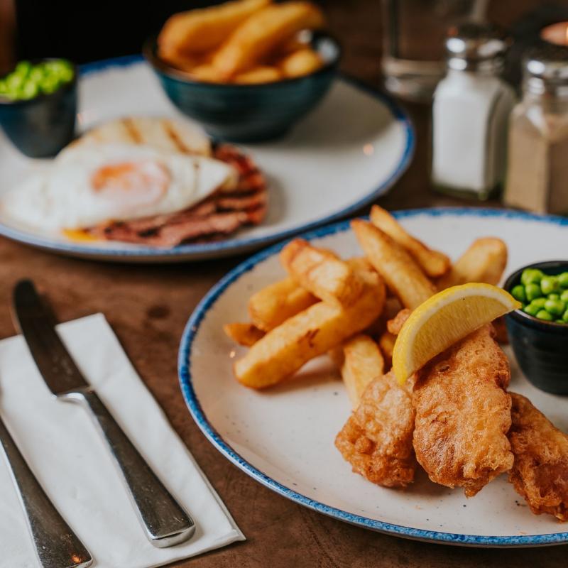 Pub lunch with fish and chips, peas, and tartar sauce