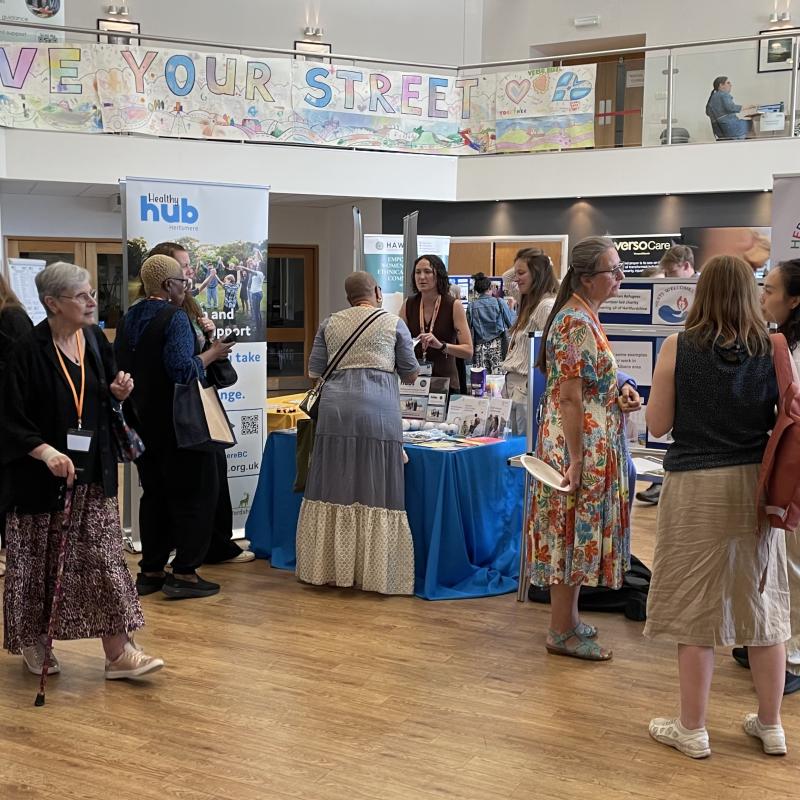 Conference marketplace showing stalls and people milling around