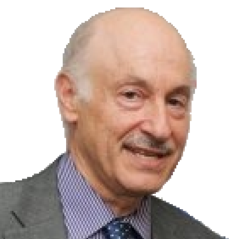 Photo of a smiling man. He is wearing a grey suit, blue shirt and blue tie